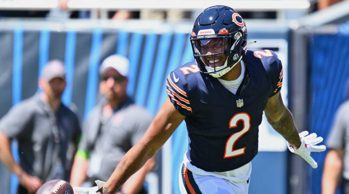 Bears wide receiver DJ Moore celebrates after scoring a 62-yard touchdown .